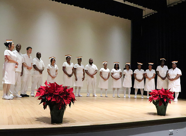 Nurses at a pinning ceremony