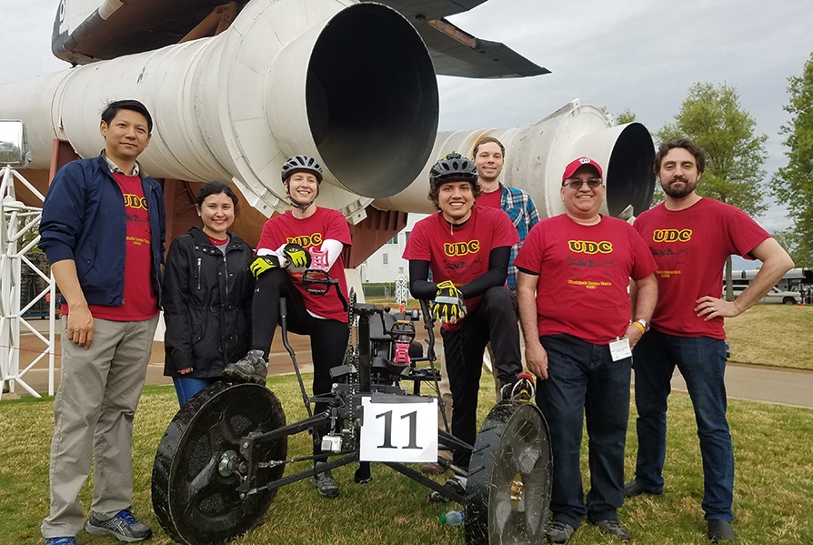 SEAS students in front of an airplane