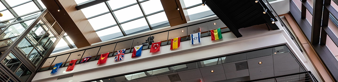 student hall with hanging flags from other countries