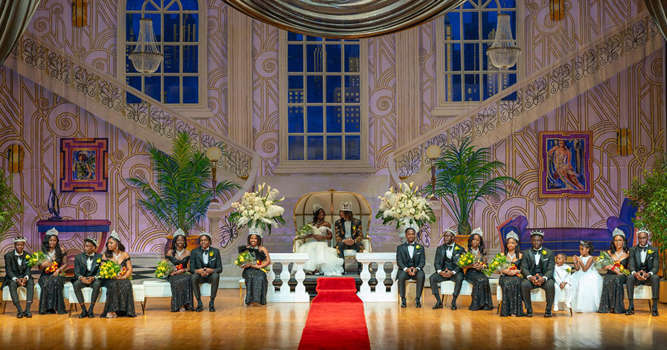 UDC Coronation 2024. The royal court sitting on a stage.