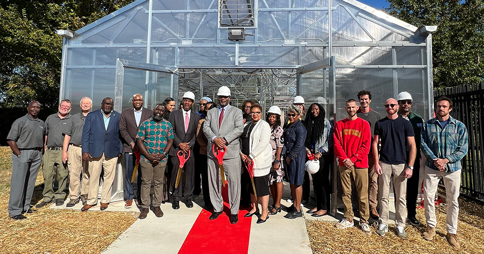 UDC President Maurice Edington and participants of the greenhouse ribbon cutting ceremony at Anacostia High School.