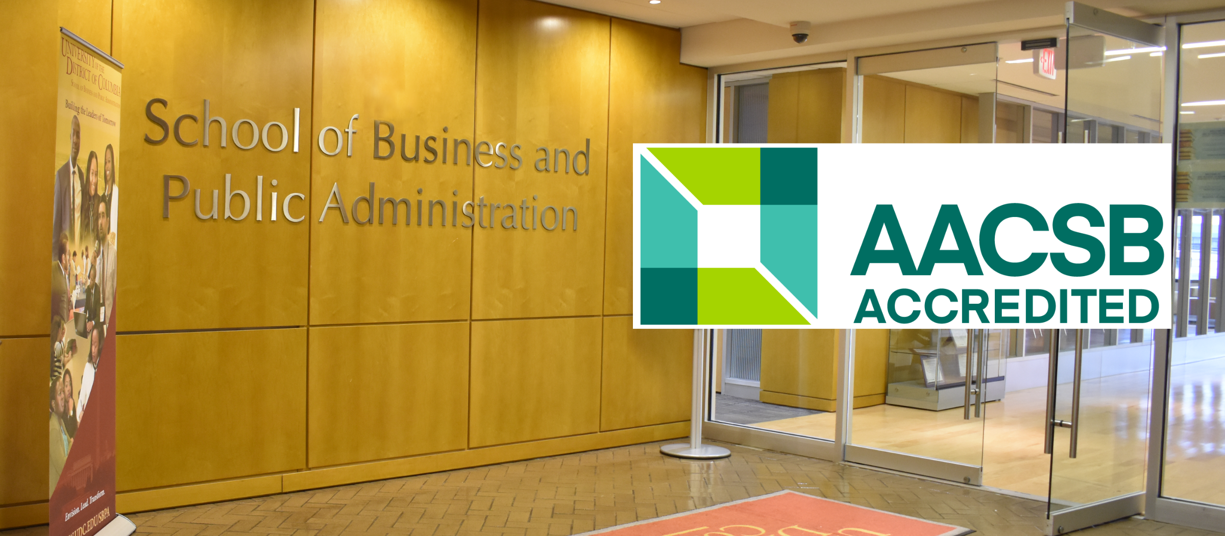 AACSB logo over a picture of SBPA office